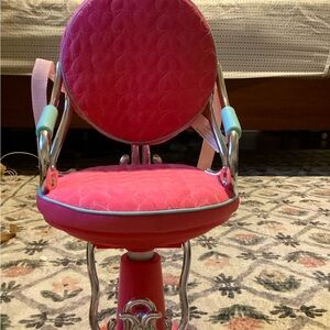Our generation pink salon chair. Can be put higher or lower.